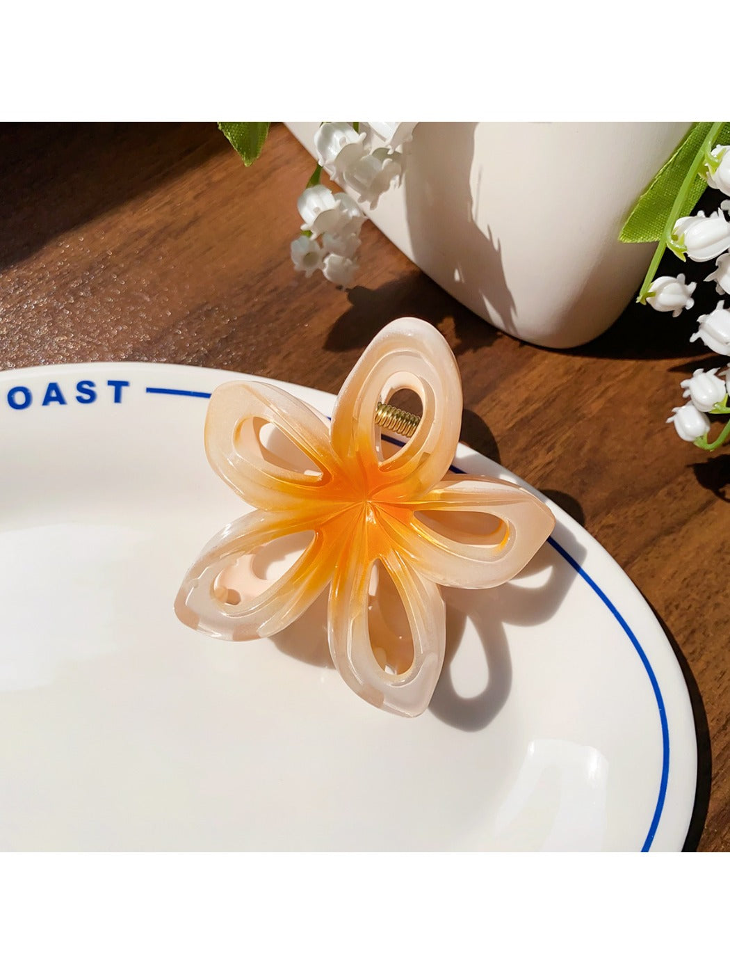 Beau classic hair claw clip in beige with floral cutout pattern