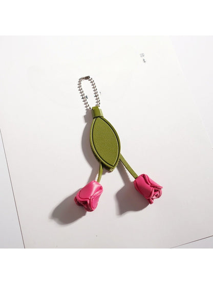 Top view of the tulip keychain highlighting the green stem and leaves