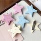 Close-up of Beau star shape hair clip showing acetate texture
