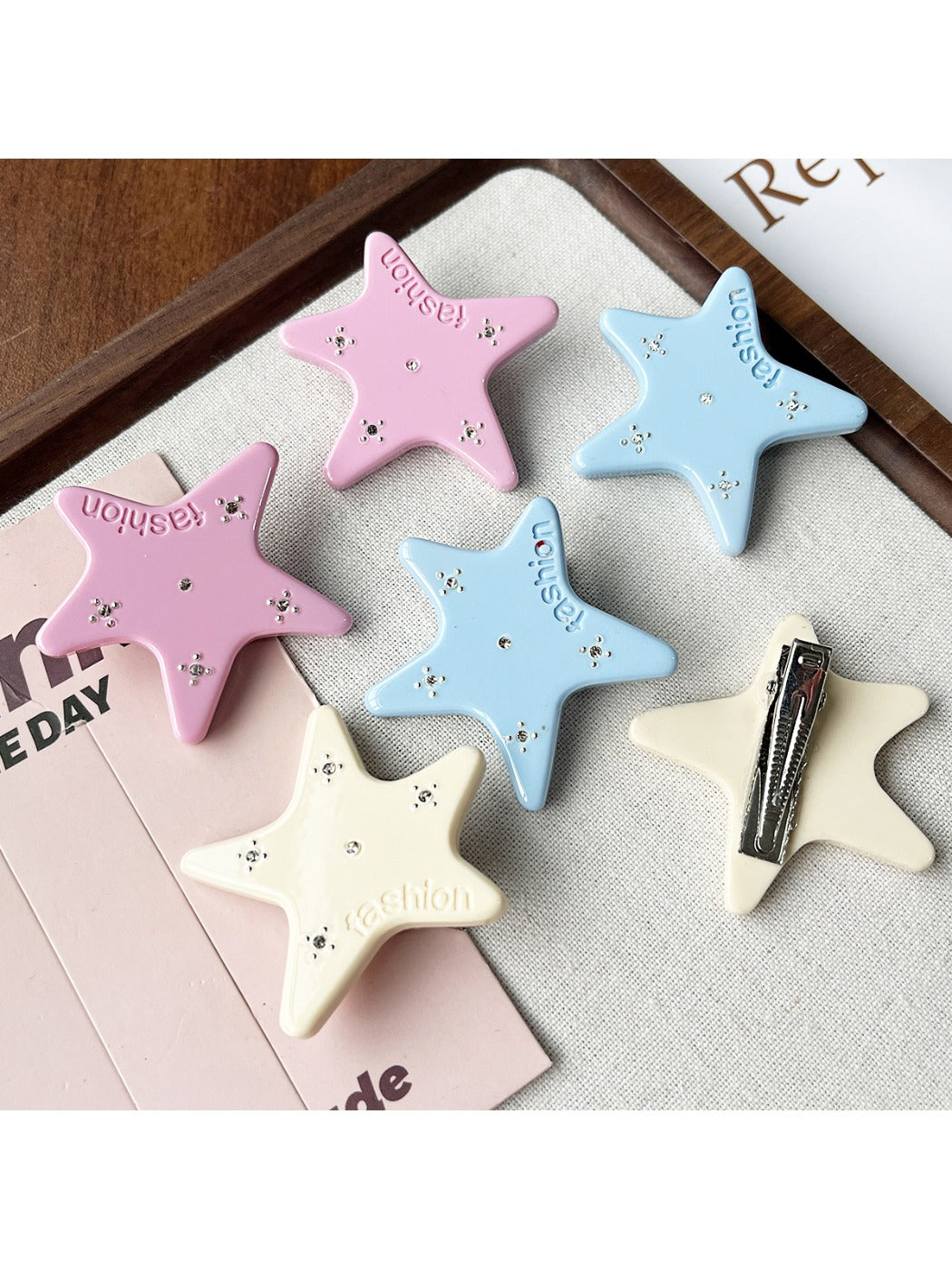 Close-up of Beau star shape hair clip showing acetate texture