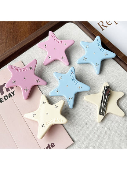 Close-up of Beau star shape hair clip showing acetate texture