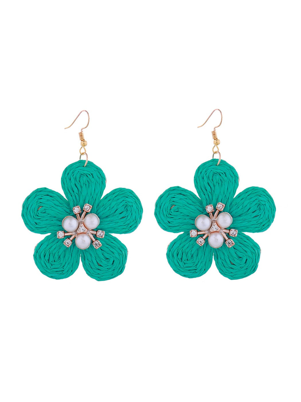 Raffia flower-shaped earrings arranged with natural elements like dried flowers and leaves