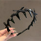 Gifty bow toothed non slip headband worn on model with hair styled back