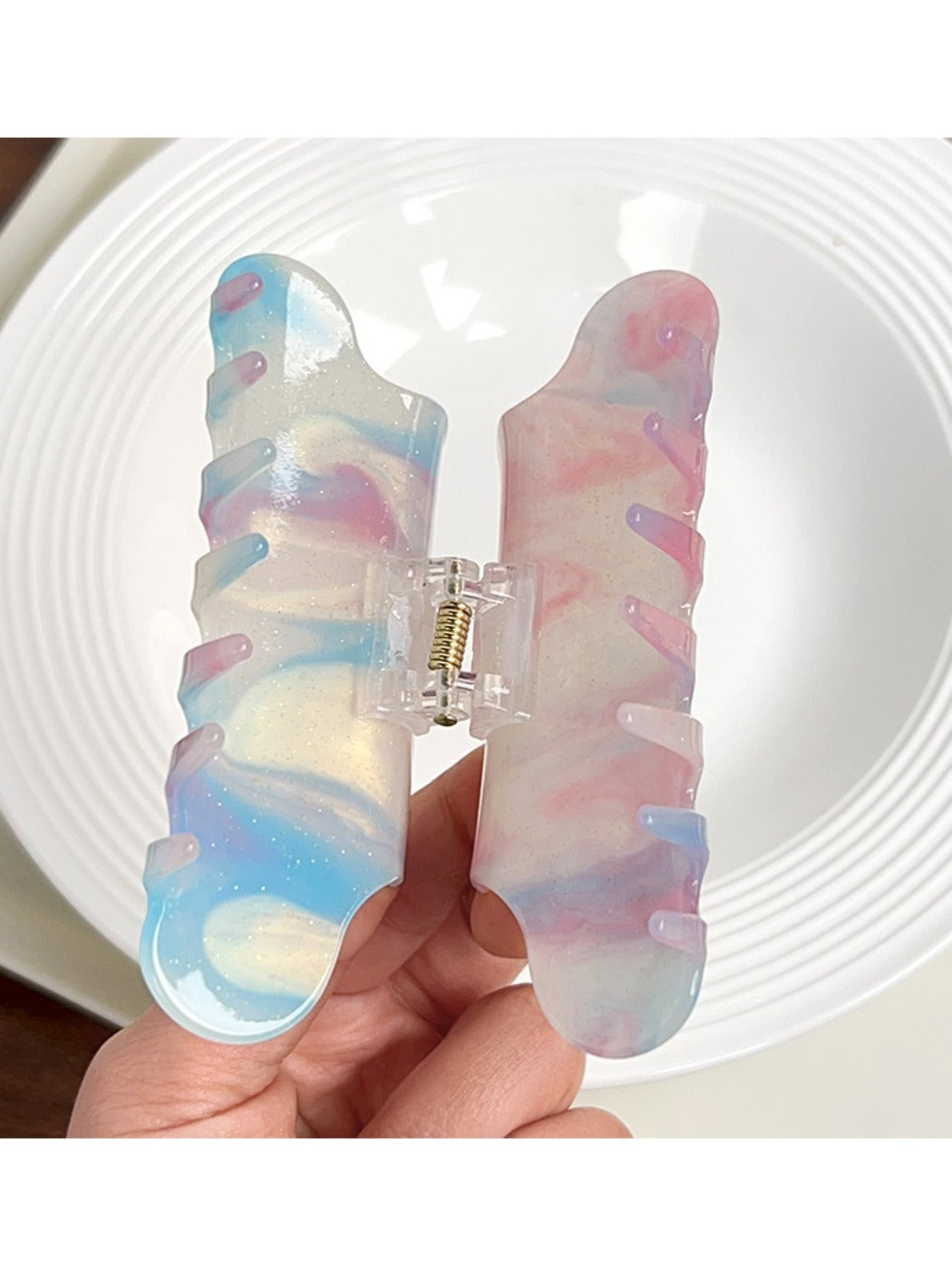 Side view of Beau cloud shaped hair claw clip with metal spring mechanism