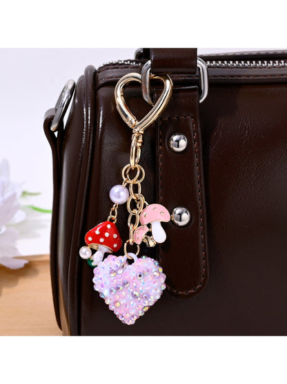Close-up of sparkling rhinestone heart keychain showing detailed stones