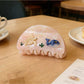 Back view of Beau Coastal Ocean Series acetate hair clip showing metal clasp mechanism