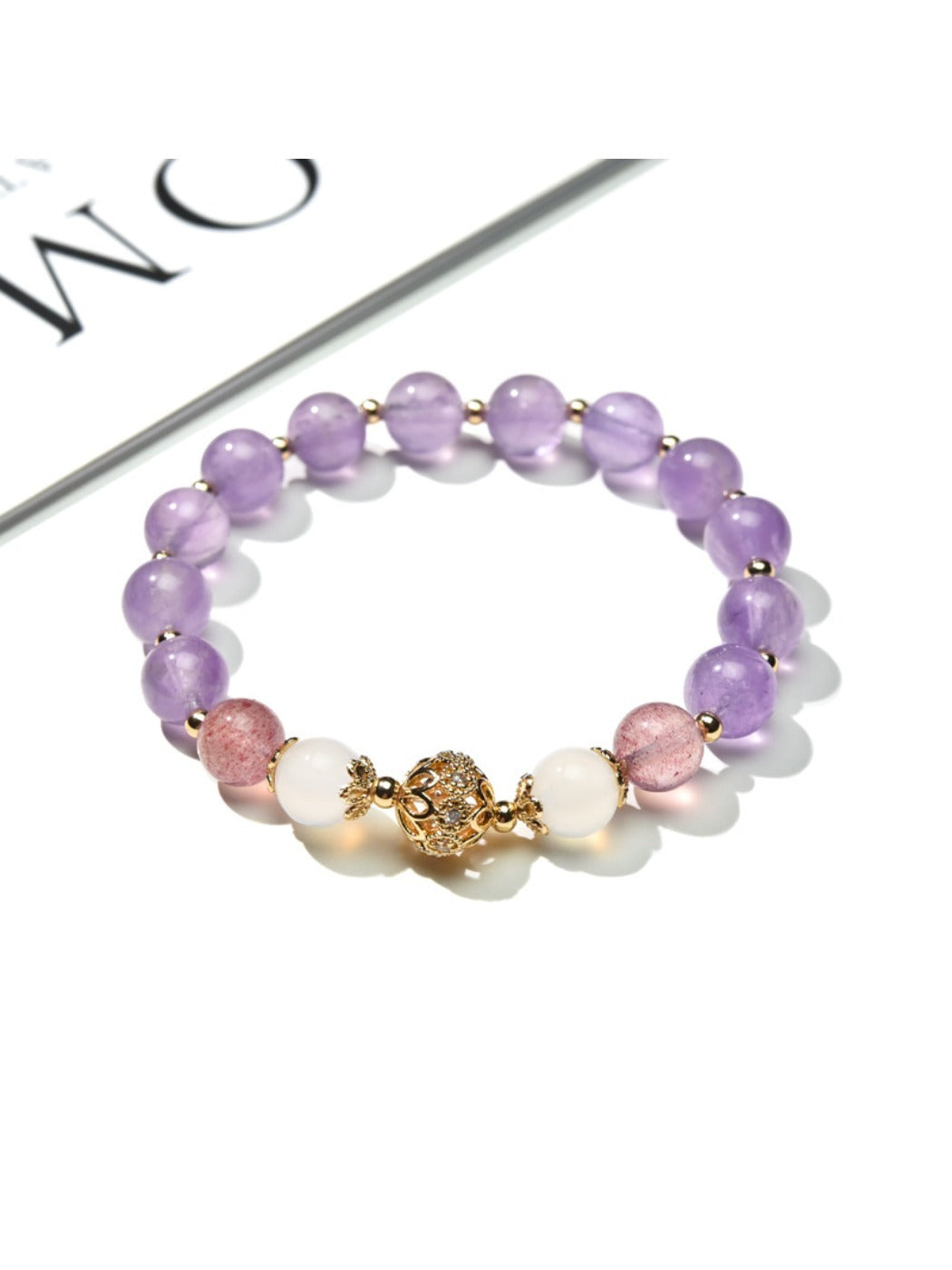 Side view of Lovra vintage purple beaded bracelet showing bead texture and color