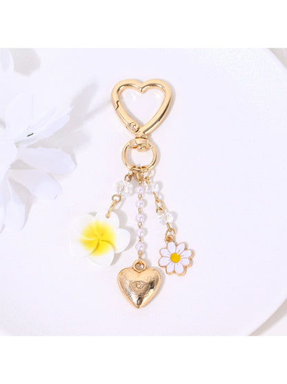 Heart flower keychain showing detailed stitching and gold ring