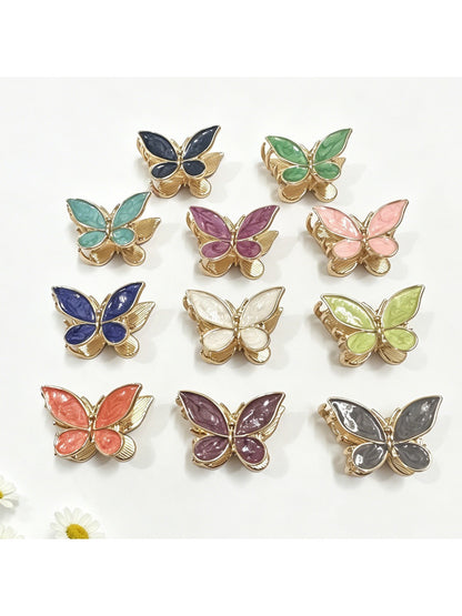 Beau comfortable butterfly shaped hair clip in pastel pink on white background