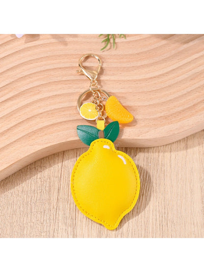 Lemon-shaped keychain displayed on a white background highlighting its shape and color