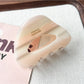 Beau hollow oval claw clip with teeth visible from the side