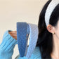Side view of Gifty diamond pattern headband showing texture and color