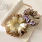 Close-up of vintage yellow ruffle scrunchie with textured fabric