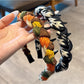 Close-up of Gifty fashion fabric twist headband in soft pastel pink