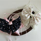 Close-up of Beau Sweet Tiny Floral Bow Claw Clip highlighting floral pattern