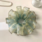 Model wearing vintage minimalist ombre hair scrunchie in a ponytail