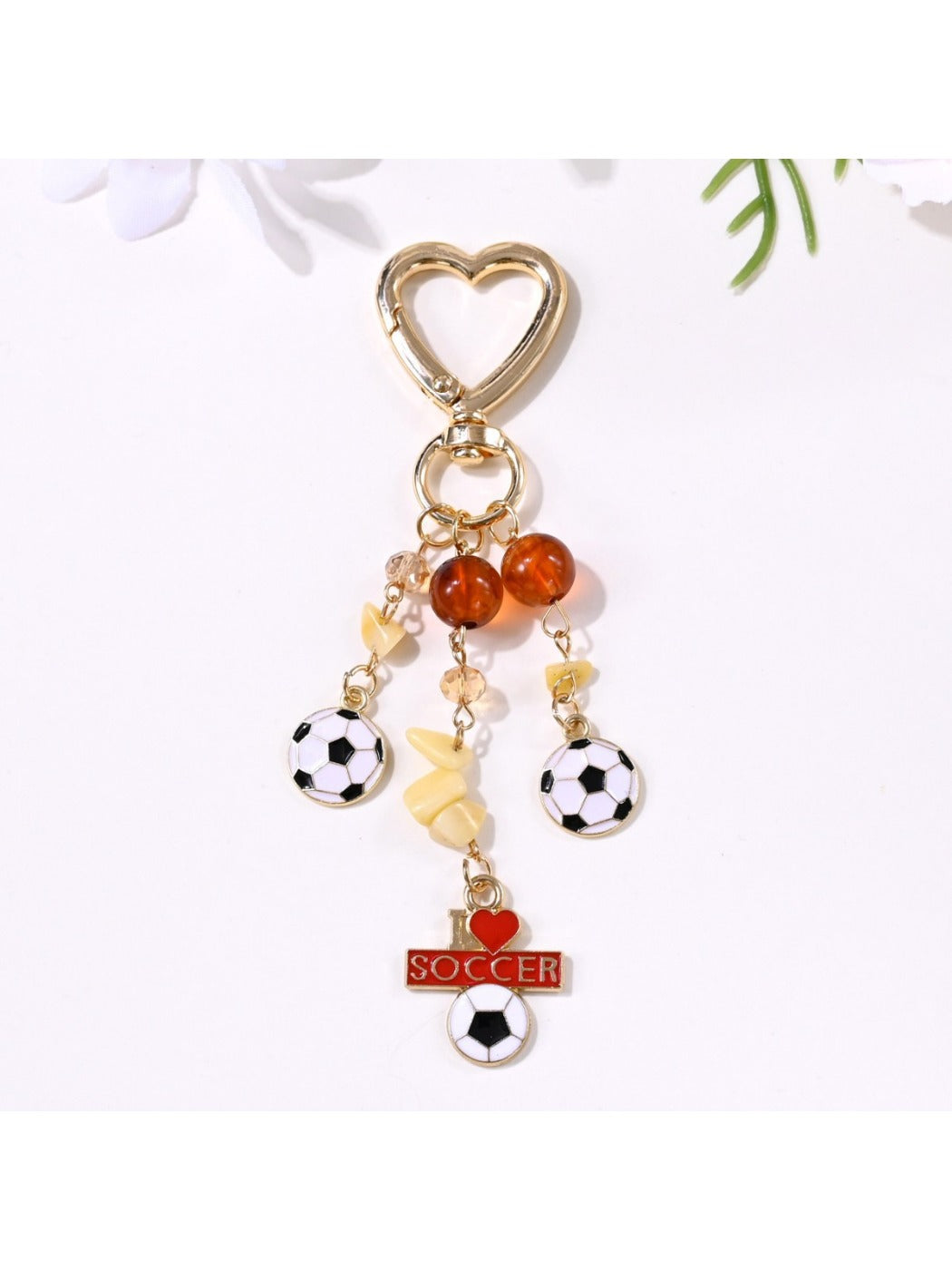 Detailed shot of the stitching and material on the sports ball pendant
