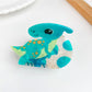 Beau hair claw clips in various animal shapes arranged on white background