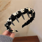 Gifty knitted fabric wrapped headband folded to show flexibility and softness