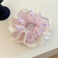 Gifty scrunchie packaged in a clear plastic bag with branding label