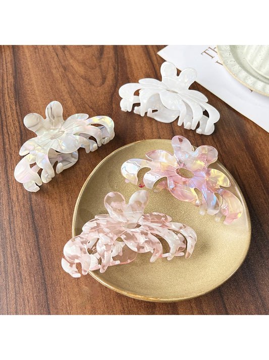 Beau sweet chic flower shaped claw clip in soft pink on white background