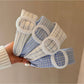 Gifty minimalist plaid circular headband in neutral tones on white background