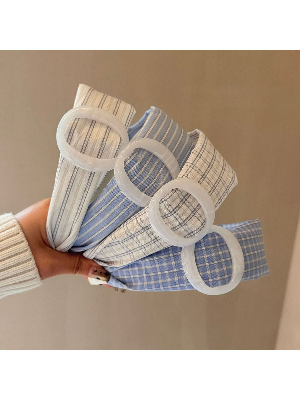 Gifty minimalist plaid circular headband in neutral tones on white background