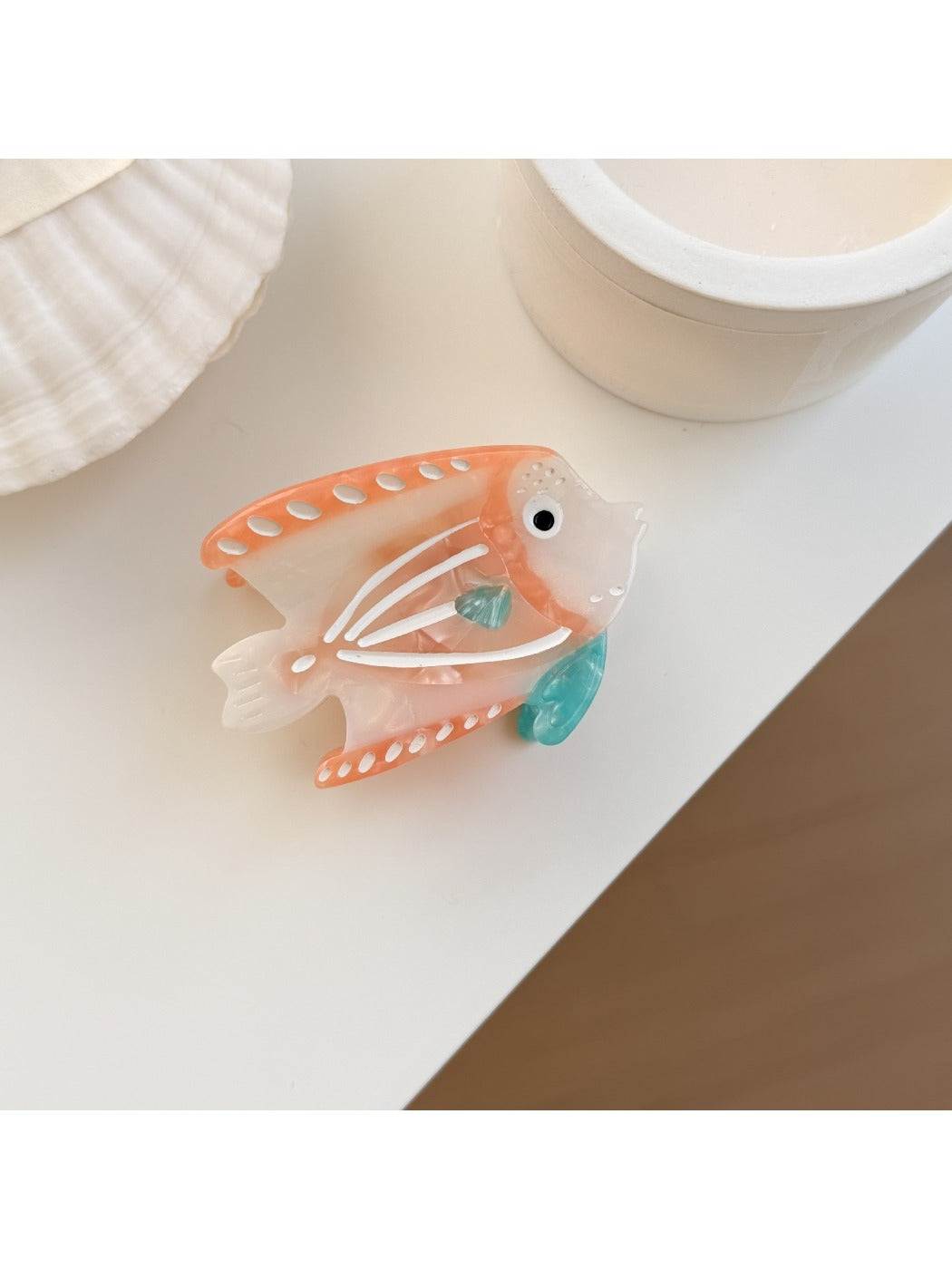 Beau colorful fish claw clip displayed alongside other hair accessories