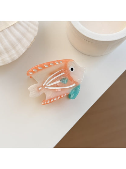Beau colorful fish claw clip displayed alongside other hair accessories