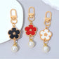 Keypus flower charm keychain displayed hanging from a set of keys