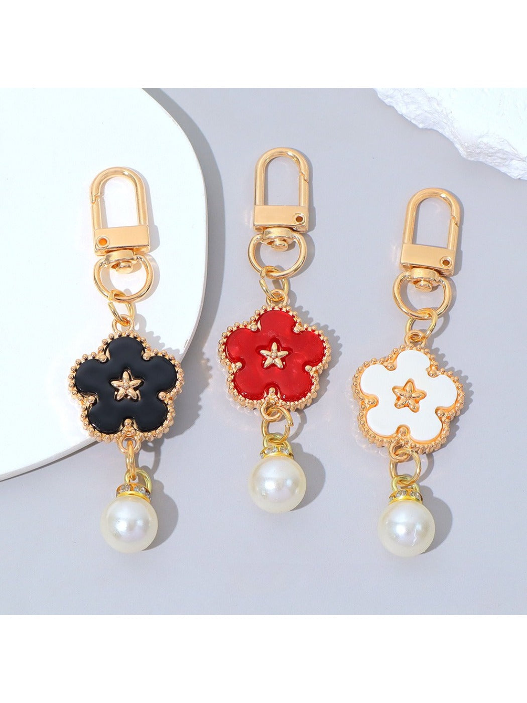 Keypus flower charm keychain displayed hanging from a set of keys