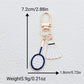 Top view of alloy badminton shuttlecock keychain highlighting feather design