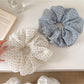 Close-up of Gifty tulle scrunchie showing delicate polka dot pattern
