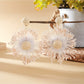 Sweet Flower Firework Shaped Earrings in a jewelry box with soft lighting