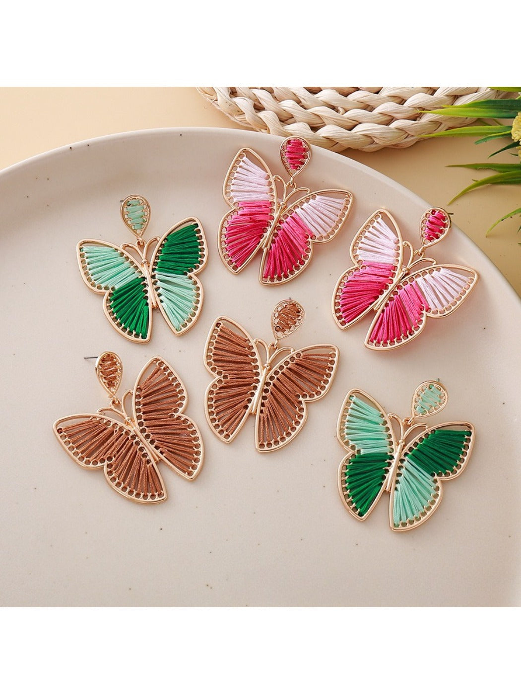 Close-up of Earedge elegant butterfly shaped drop earrings in silver
