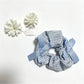 Gifty Sweet Bow Embellished Plaid Scrunchie displayed flat highlighting bow embellishment and plaid fabric