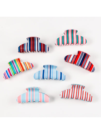 Side view of Beau striped half moon claw clip highlighting curved shape