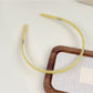 Gifty headband displayed with matching accessories on table