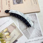 Beau - Curved Mottled Banana Hair Clip