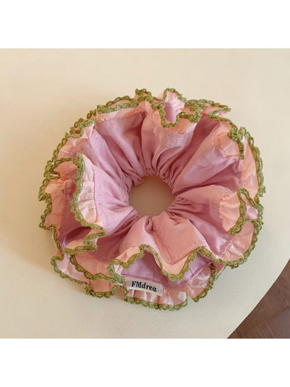 Pink lace trim double scrunchie shown from side angle