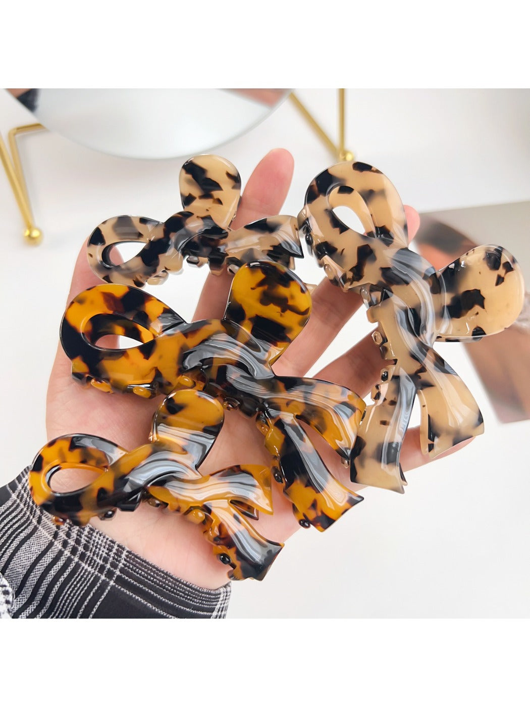 Close-up of Beau bow shaped hair claw clip showing smooth matte finish