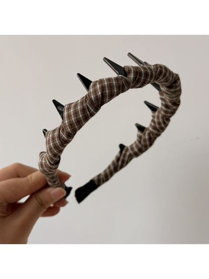 Top view of vintage plaid wrap headband highlighting fabric folds and colors