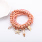 Lovra bracelet with ocean pendant and alternating blue and white beads close-up