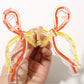 Side view of Beau Sweet Ribbon Knot Hair Clip highlighting clip mechanism and bow shape