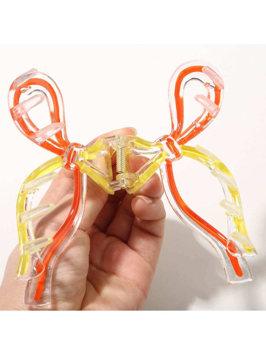 Side view of Beau Sweet Ribbon Knot Hair Clip highlighting clip mechanism and bow shape