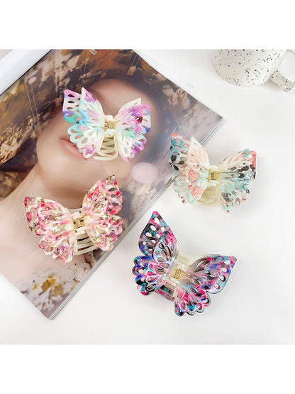 Beau double layer hollow bow shaped claw clip in beige on white background