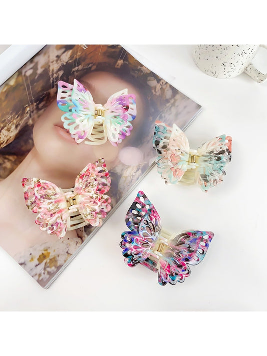 Beau double layer hollow bow shaped claw clip in beige on white background