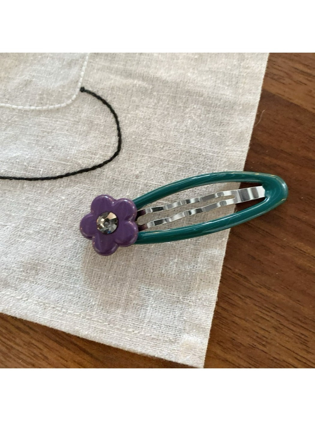 Beau hair clip featuring colorful floral print and silver metal clip