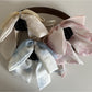 Beau bow ribbon streamer claw clip in soft pink fabric with layered ribbon design