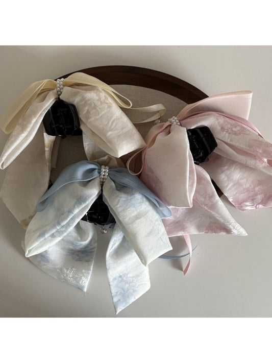 Beau bow ribbon streamer claw clip in soft pink fabric with layered ribbon design